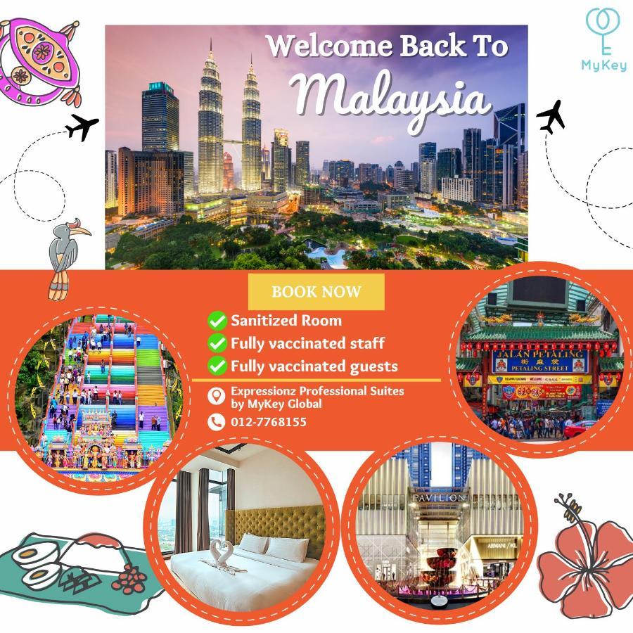 Expressionz Professional Suites By Mykey Kuala Lumpur Exterior foto A poster advertising the reopening of Malaysia's borders to tourists.